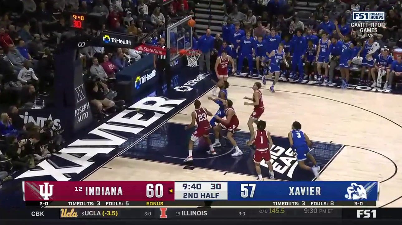 Xavier's Adam Kunkel hits a game tying three pointer in the second half against the Hoosiers