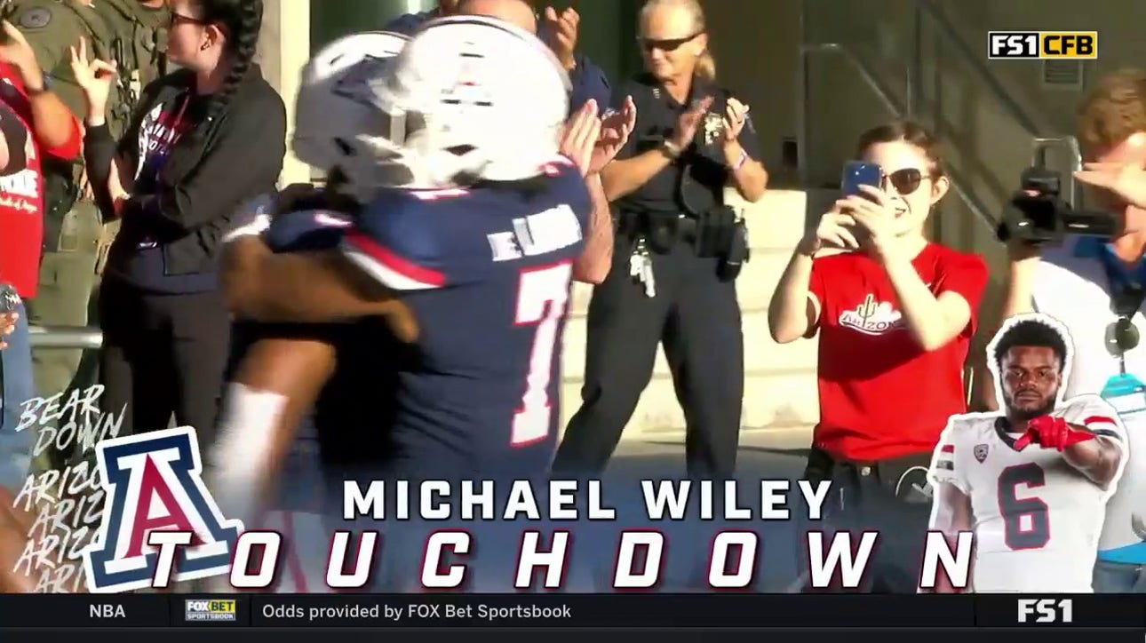 Arizona's Michael Wiley gets a hat-trick after rushing for a 72-yard TD for his third TD of the game