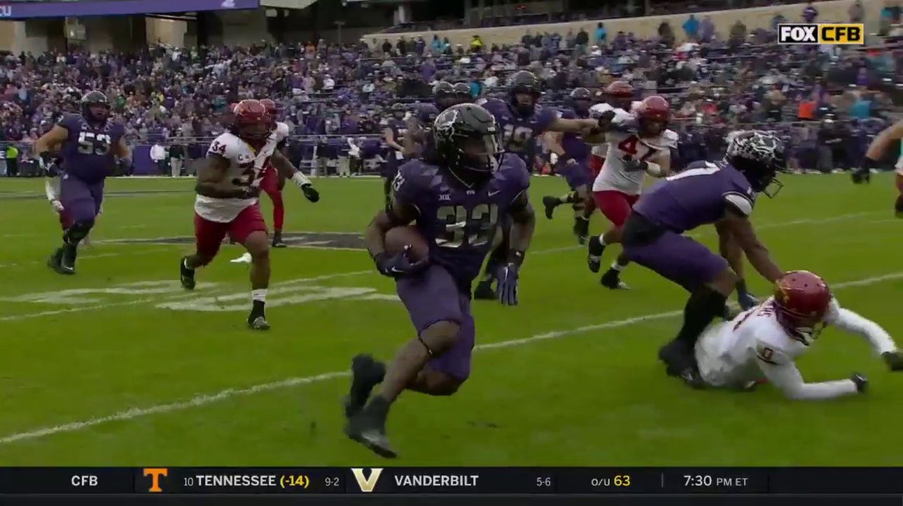 Kendre Miller hits a spin move to extend the TCU lead over Iowa State