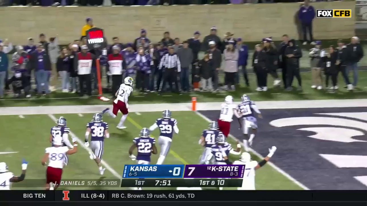 Kansas Jayhawks' Torry Locklin rushes for the 12-yard touchdown