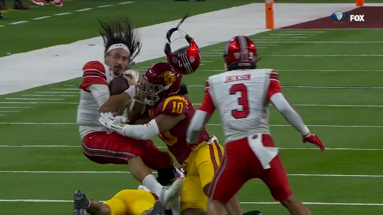 Utah's Cameron Rising gets helmet knocked off during a BRUTAL tackle against USC
