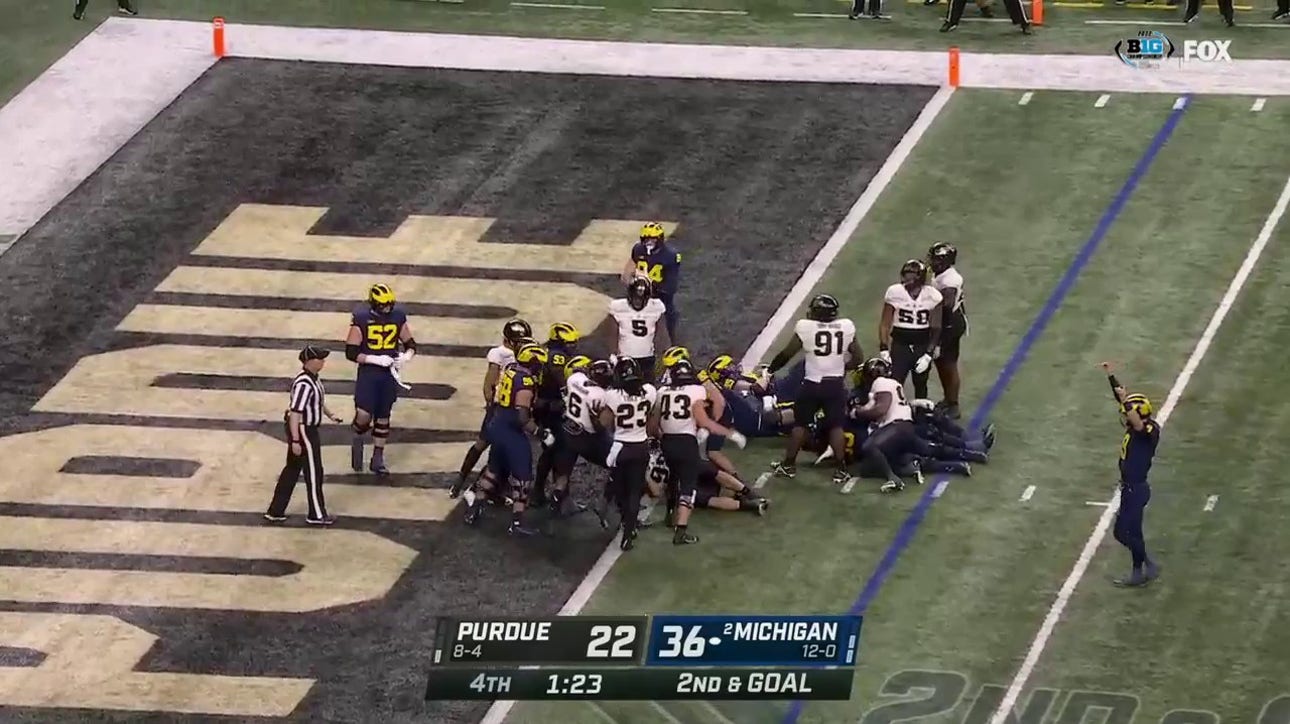 Michigan's Kalel Mullings runs in a three-yard TD to solidify a 43-22 victory over Purdue