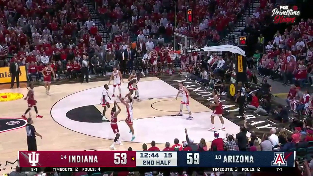 Indiana's Tamar Bates drains the three pointer to bring the Hoosiers to within three points of the Wildcats