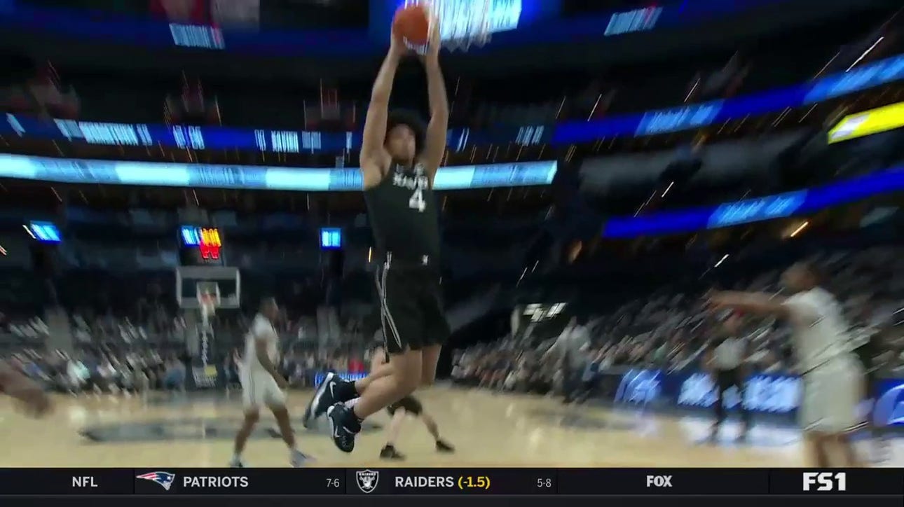 Xavier's Cesare Edwards finishes the wide open two handed dunk