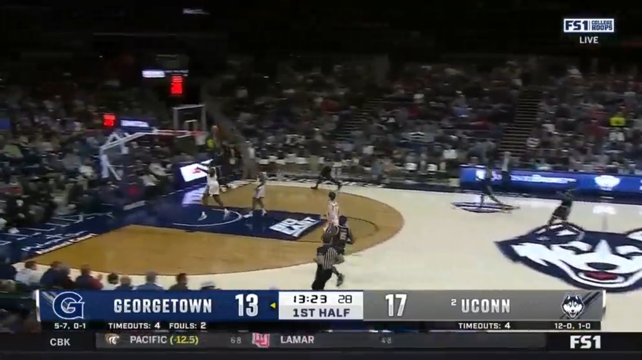Georgetown's Brandon Murray throws down the two-handed dunk after Akok Akok's magnificent block