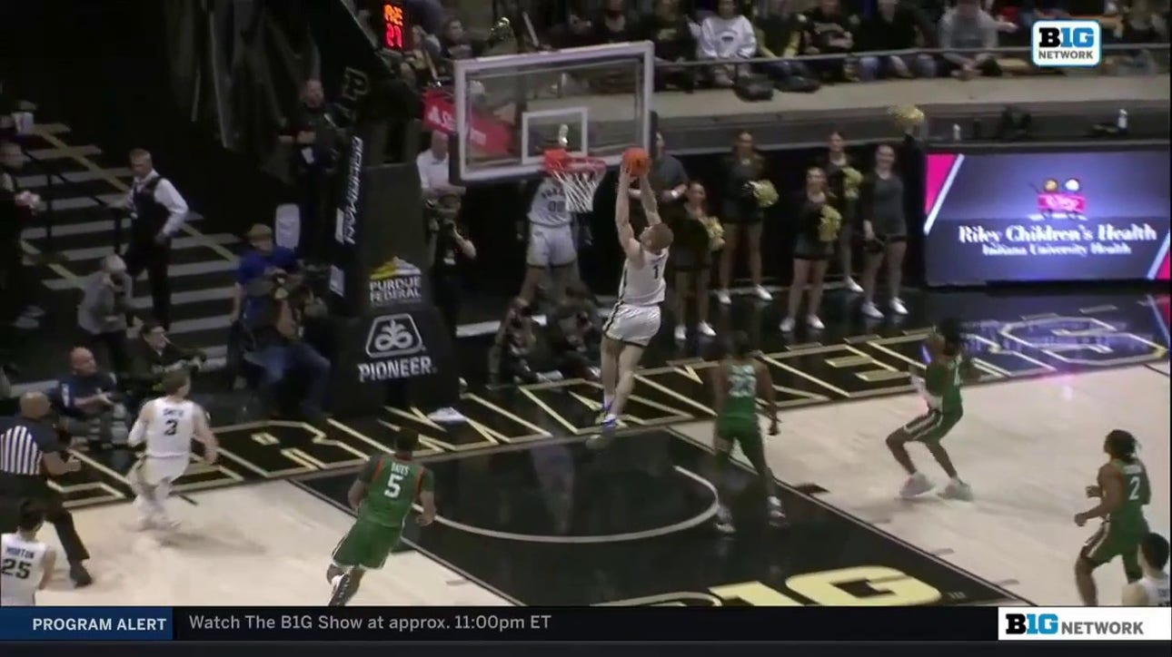 Purdue's Caleb Furst slams home a running two-handed dunk to extend the Boilermakers' lead