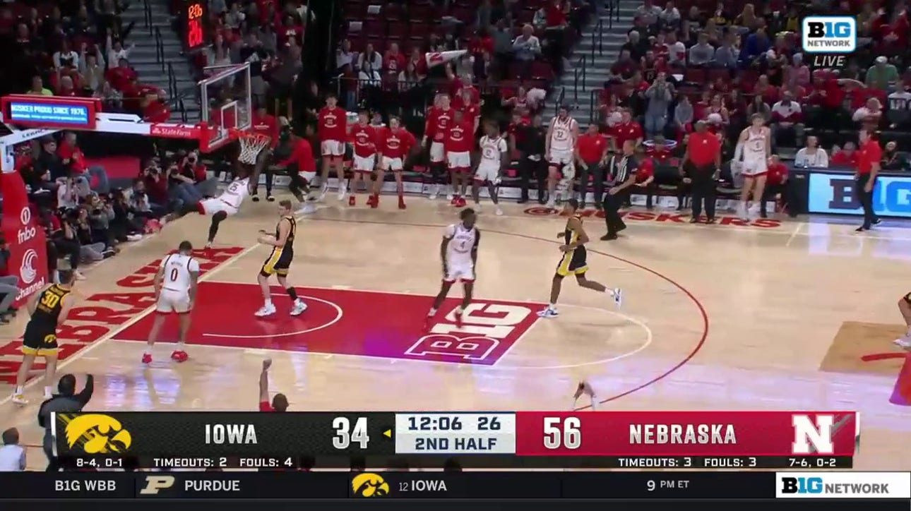 Nebraska's Emmanuel Bandoumel slams down an alley-oop dunk