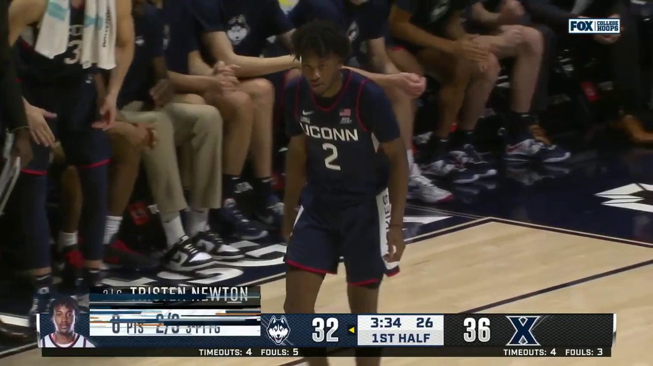 Tristen Newton finishes the beautiful transition sequence for UConn as they look to chip away at the Xavier lead