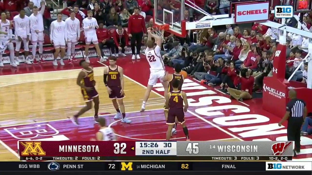 Wisconsin big man Steven Crowl capitalizes on the defensive breakdown for the jam