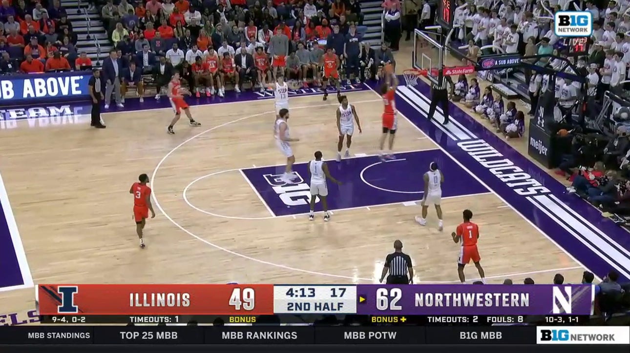 Illinois' Coleman Hawkins hammers in a fast-break dunk against Northwestern