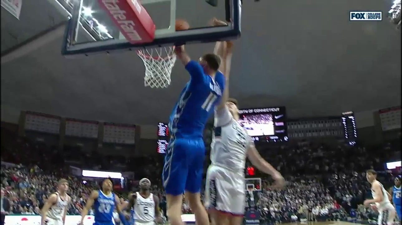 Ryan Kalkbrenner finishes the alley-oop slam through contact to extend Creighton's lead early