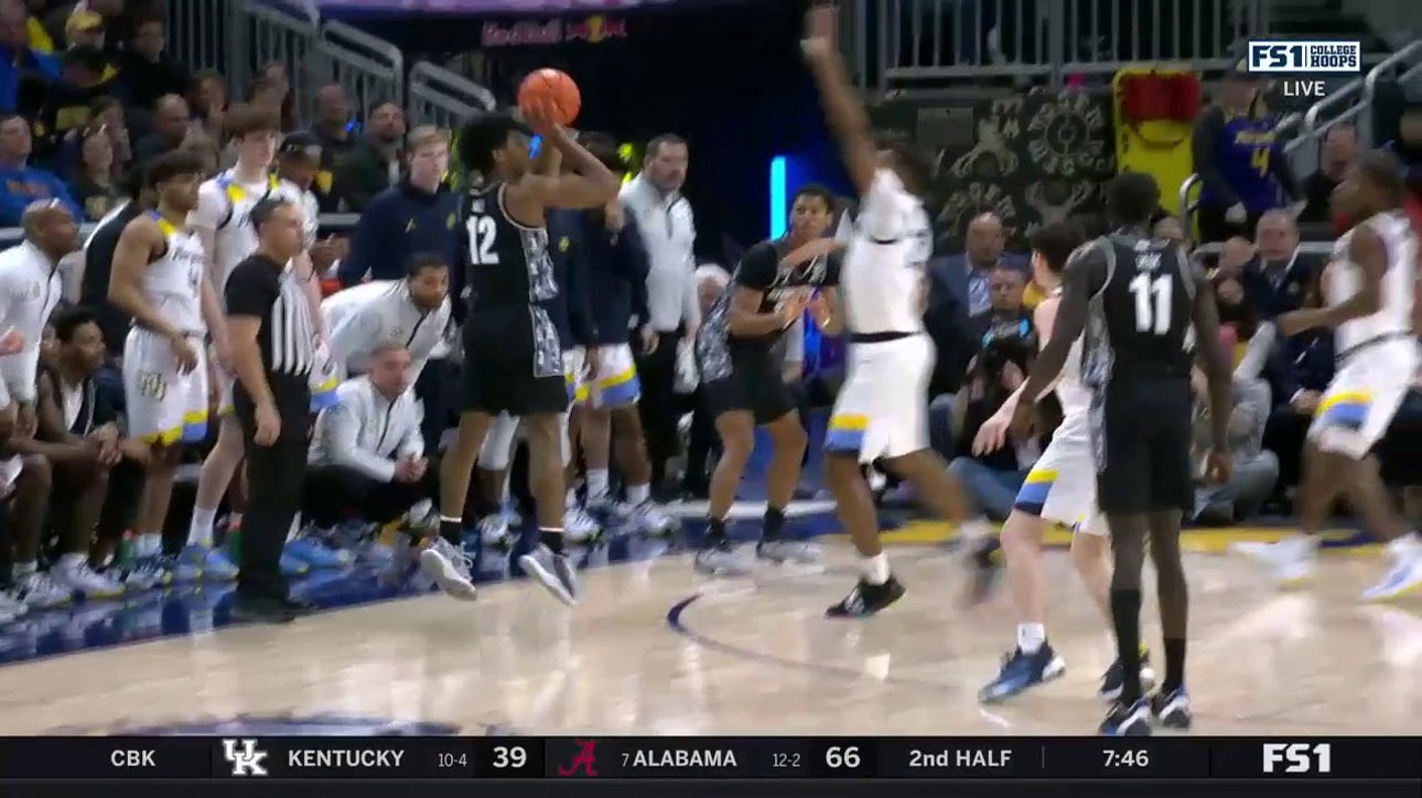 Jordan Riley hits a three pointer plus the foul to give Georgetown the lead over Marquette
