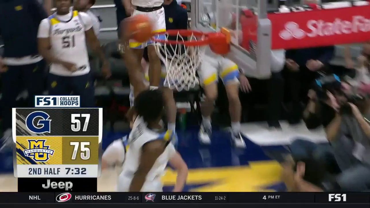 Chase Ross throws down a one-handed poster jam extending Marquette's lead