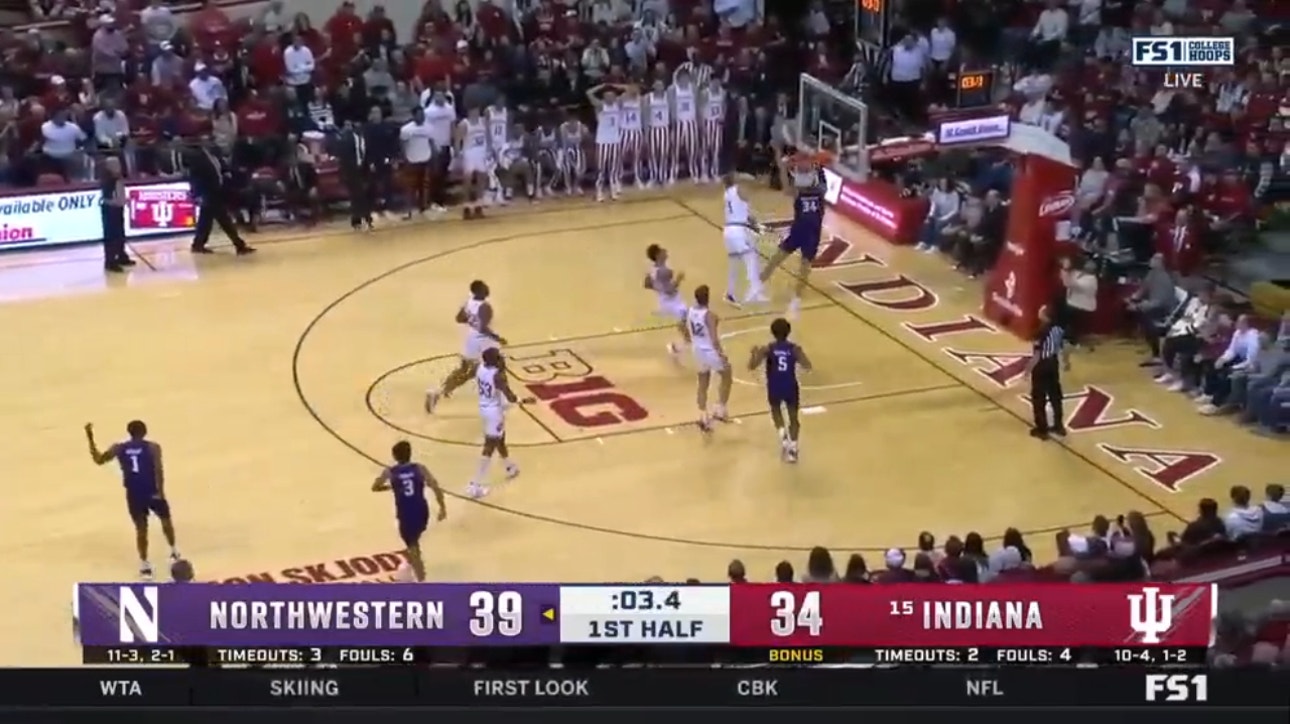 Matthew Nicholson hangs on the rim to close out first half for Northwestern 41-34 against No. 15 Indiana