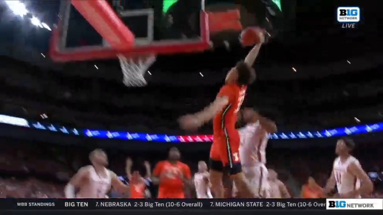 Illinois' Coleman Hawkins makes a powerful dunk off a strong drive, increasing the lead over Nebraska