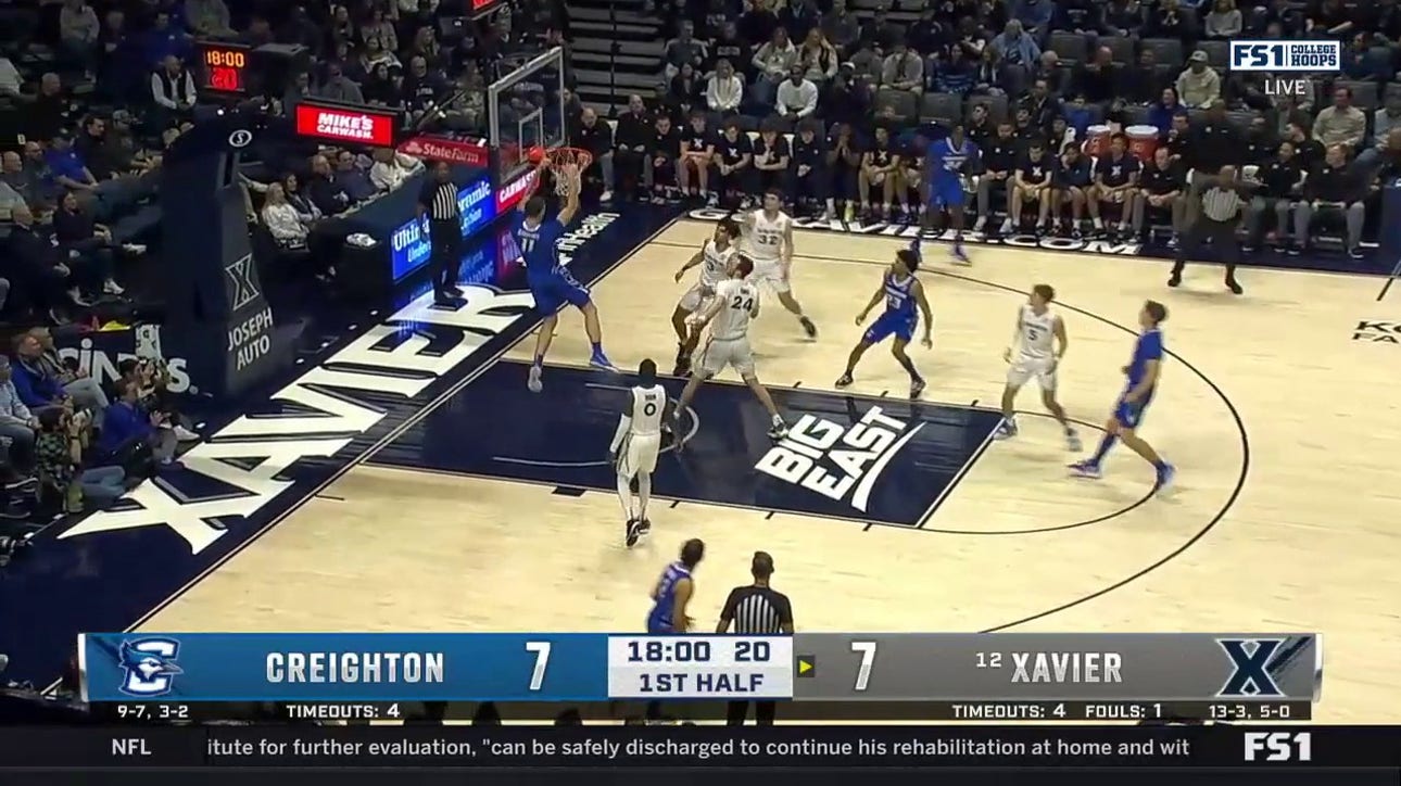 Ryan Kalkbrenner rattles the rim for a dunk as Creighton takes the lead against Xavier