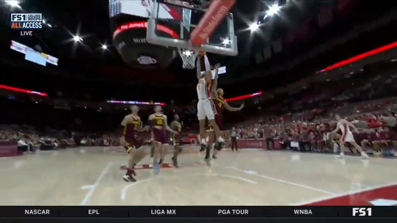 Ohio State's Tanner Holden slashes to the rim and throws down a wild jam to trim Minnesota's first-half lead