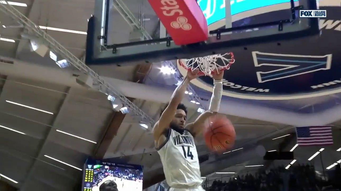 Villanova's Caleb Daniels maneuvers past the defense and throws down a wicked two-handed slam to even the score