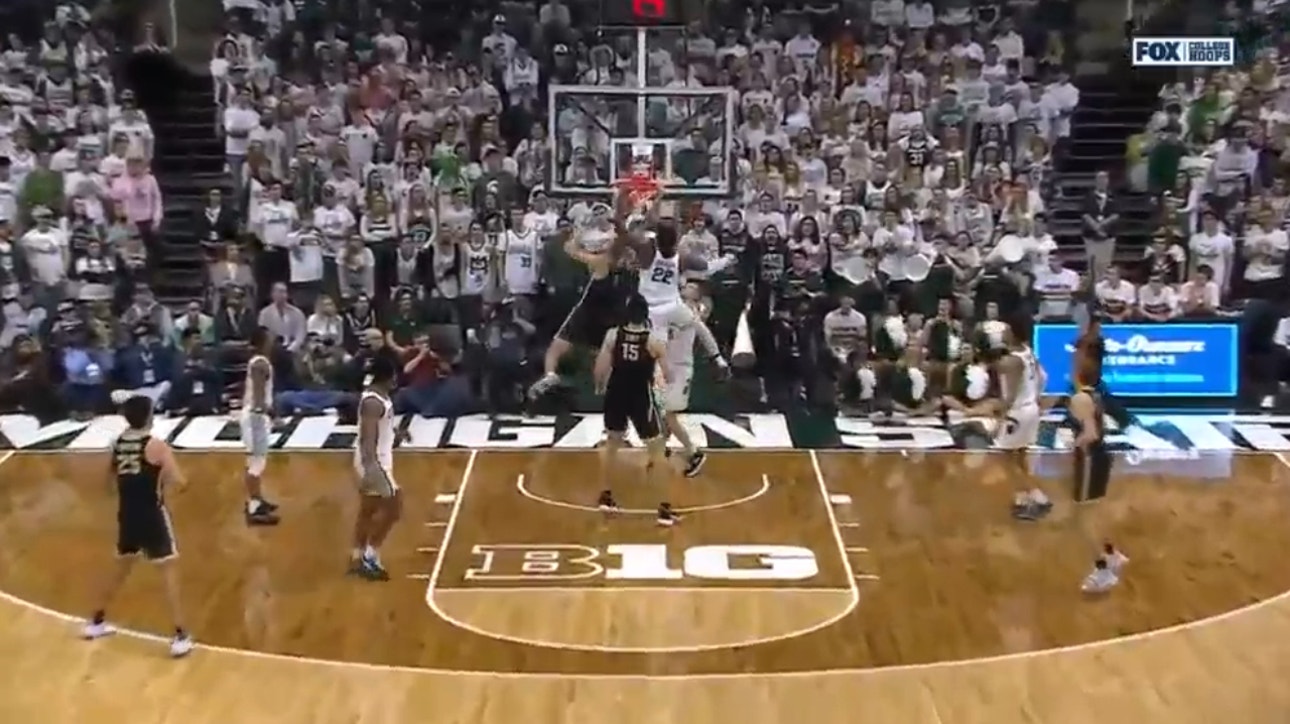 Purdue's Caleb Furst makes a contested two-handed jam against Michigan State
