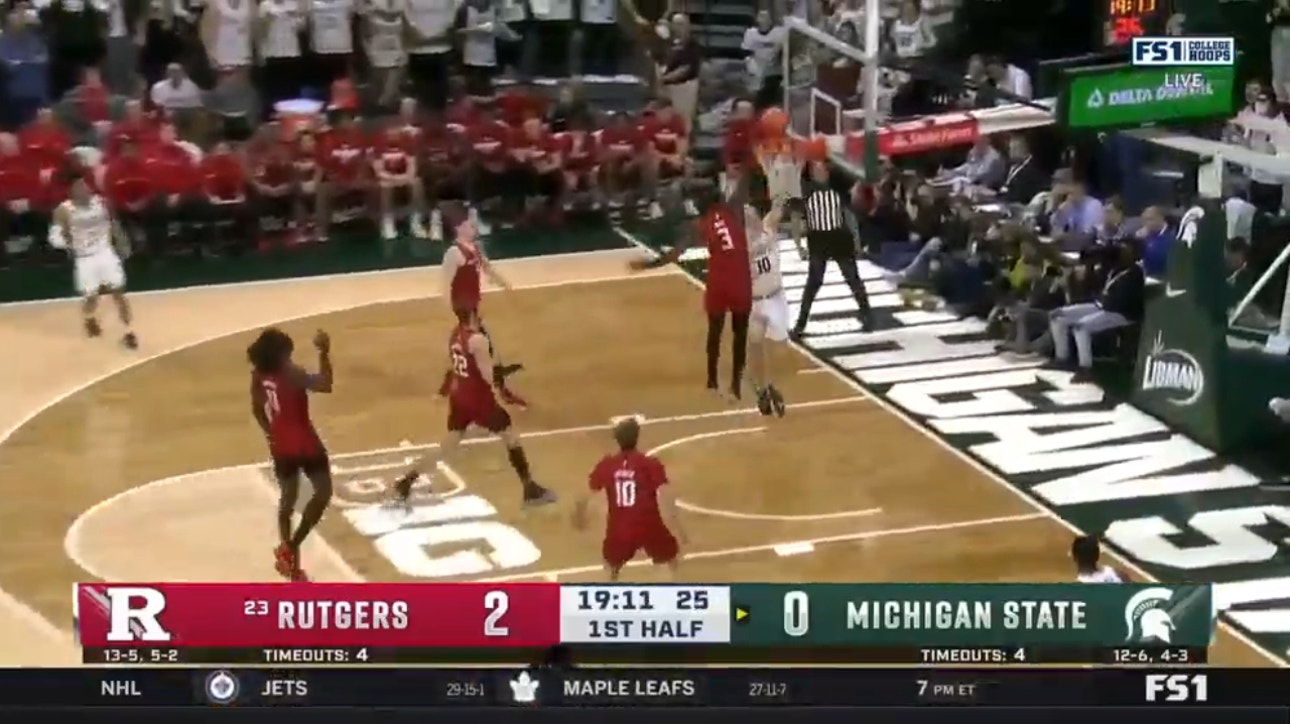 Mawot Mag blocks Michigan State and Clifford Omoruyi finishes on the other end with a one-handed slam to extend Rutgers' early lead