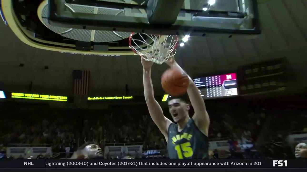 Zach Edey hammers in a massive putback slam, extending Purdue's lead 