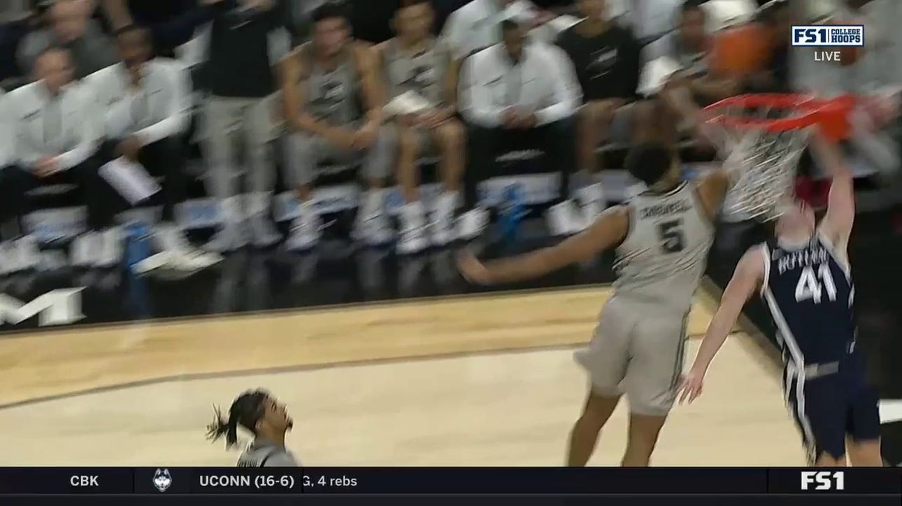 Providence's Ed Croswell shows off his hops with a block against Butler