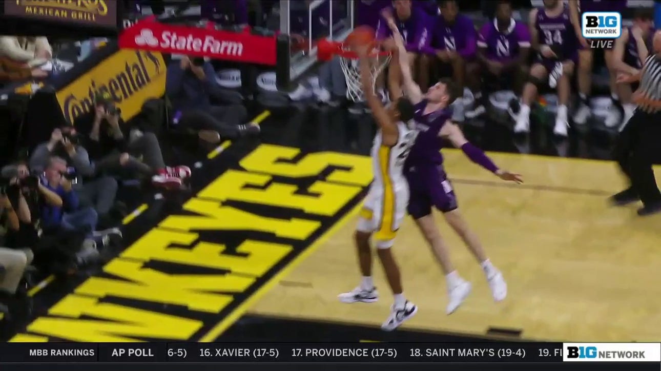 Kris Murray rattles the rim with a powerful two-handed jam for Iowa 