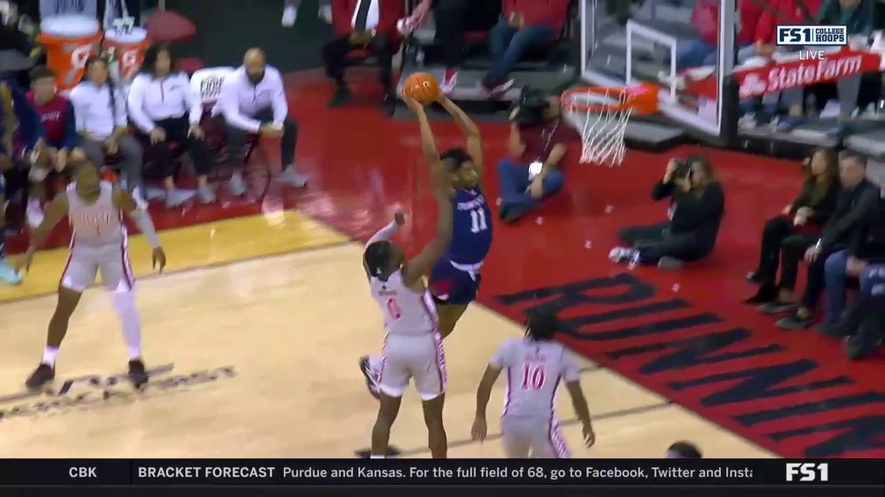 Fresno State's Isaih Moore throws down a WILD contact jam to grab the lead against UNLV