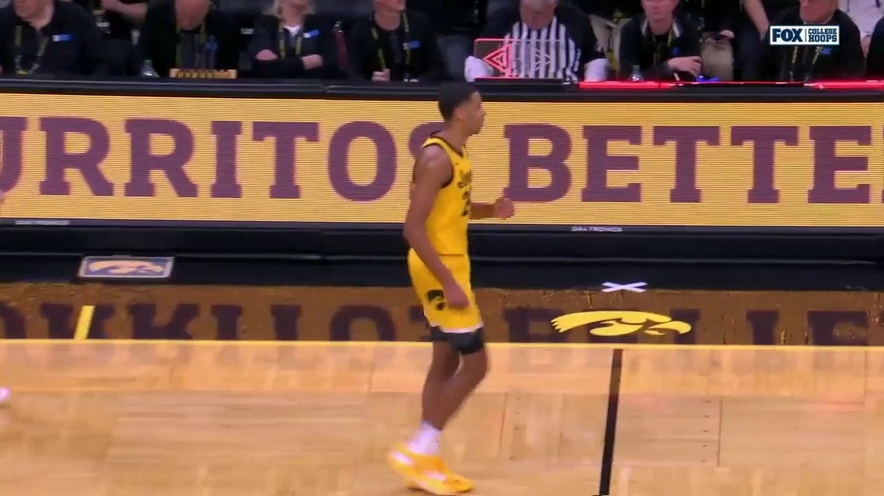 Kris Murray hits a three at the buzzer to bring trim Illinois' lead over Iowa at half