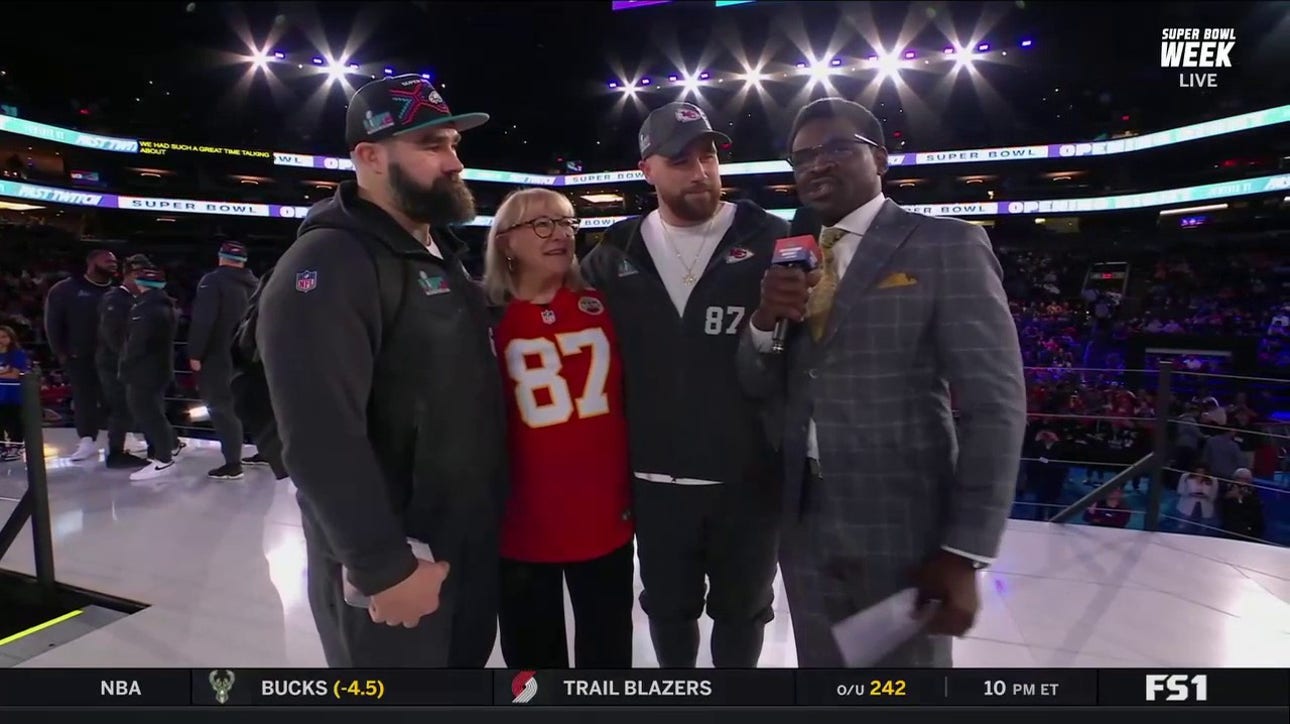 Travis Kelce and Jason Kelce are joined by their mom onstage ahead of Super Bowl LVII