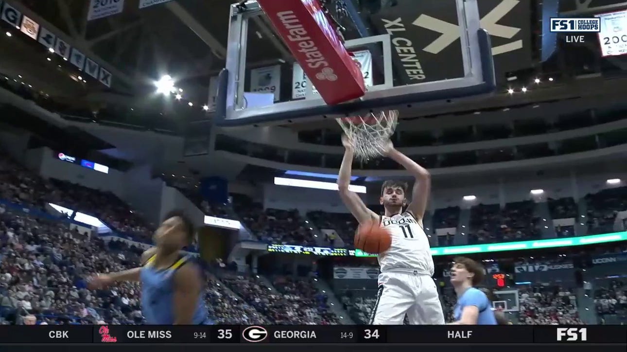 UConn's Alex Karaban delivers the two-handed jam off a beautiful pass from Tristen Newton