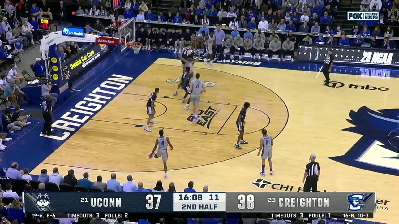 Creighton's Baylor Scheierman sneaks through defenders and pulls off a smooth reverse layup