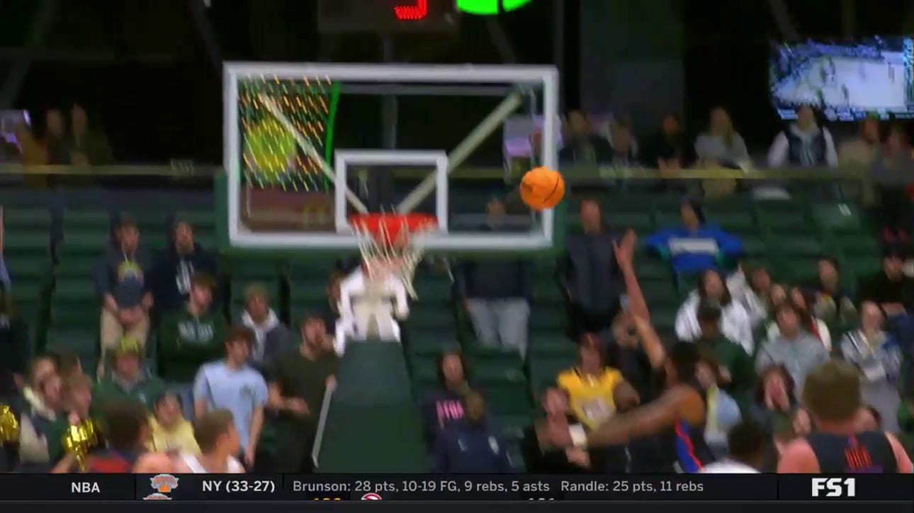 Boise State's Naje Smith gets fancy and spins for a layup against Colorado State