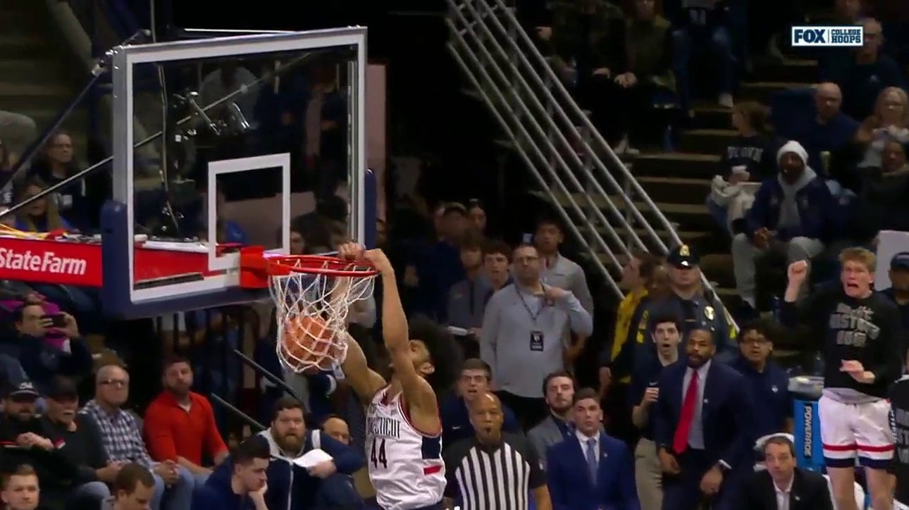 Andre Jackson Jr. takes flight to throw down a two-handed jam to extend UConn's lead over Seton Hall