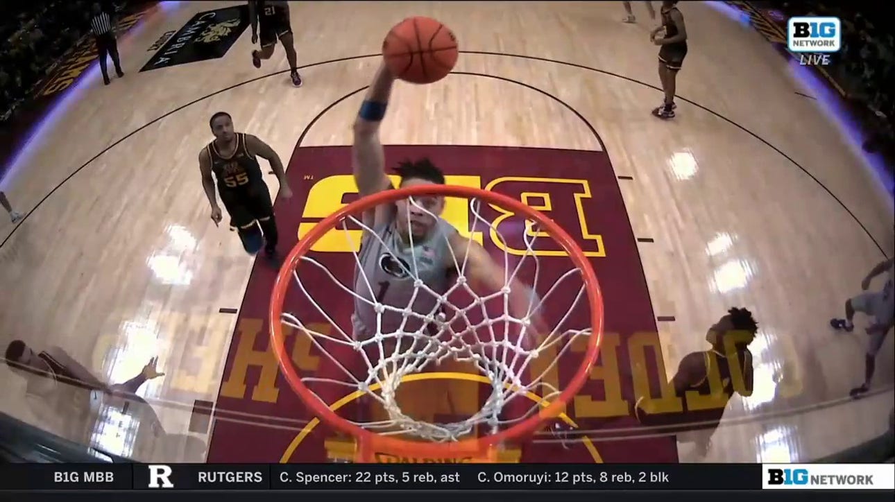 Penn State's Seth Lundy slams the one-handed dunk against Minnesota