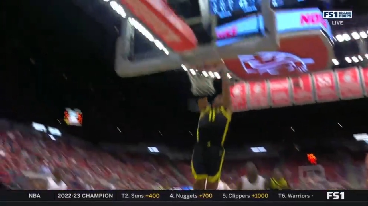 Oregon's Rivaldo Soares slams it down after a stellar pass from Will Richardson to bring game to a tie