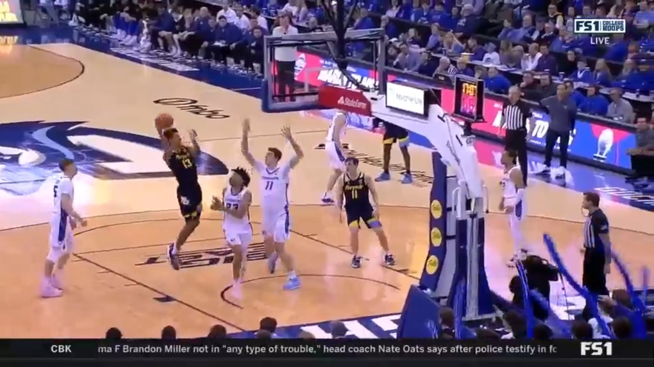 Marquette's Stevie Mitchell makes a steal, Oso Ighodaro pulls off the layup vs. Creighton