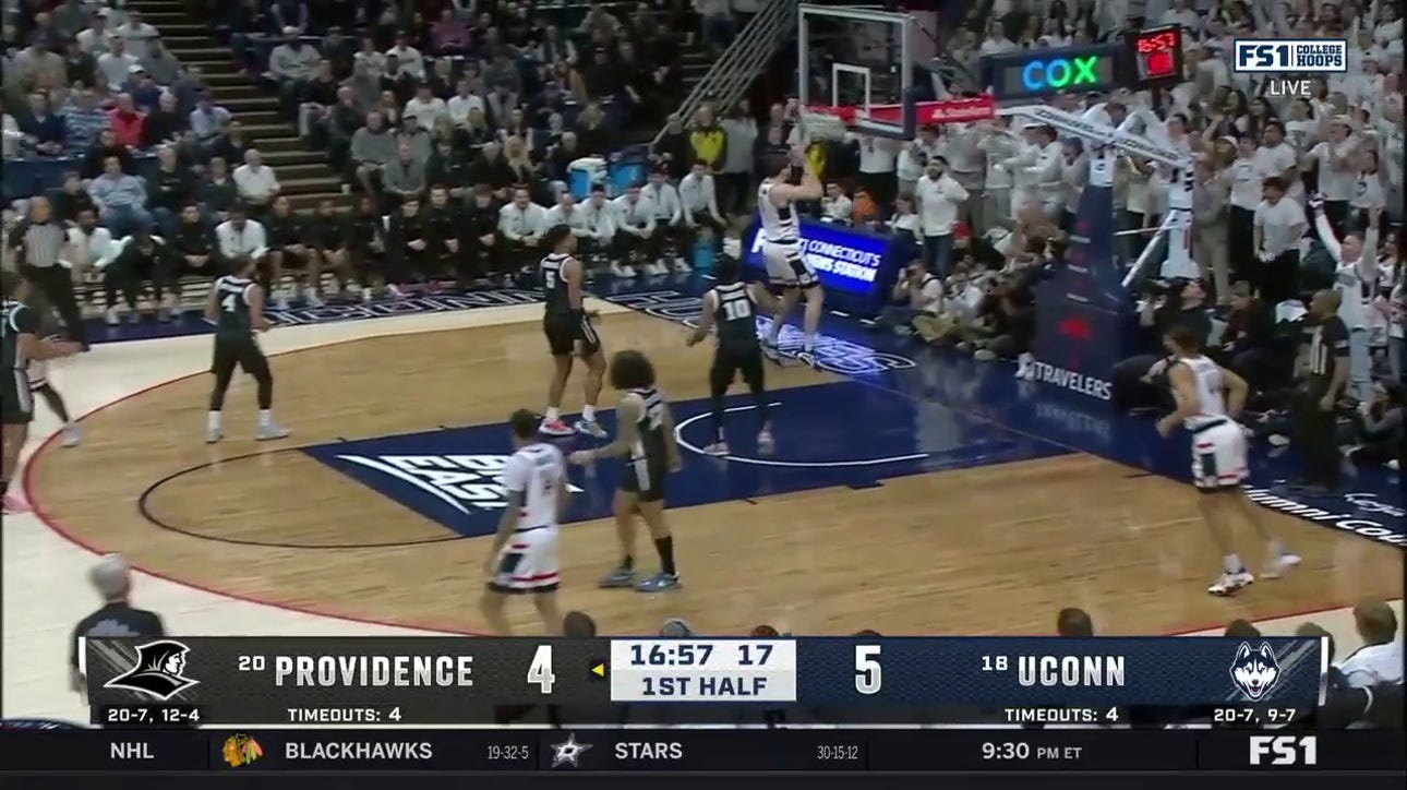 Alex Karaban rattles the rim with a powerful jam for UConn vs. Providence