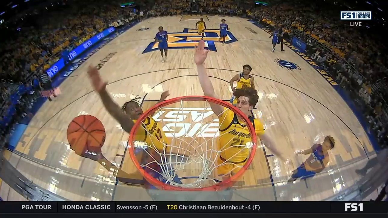 Marquette's Olivier-Maxence Prosper makes the big block against DePaul in transition