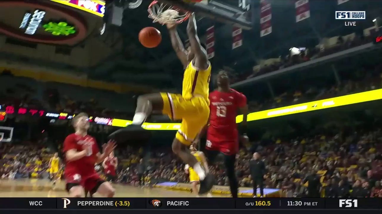 Minnesota's Dawson Garcia throws an alley-oop pass to Pharrel Payne for a monster two-handed jam