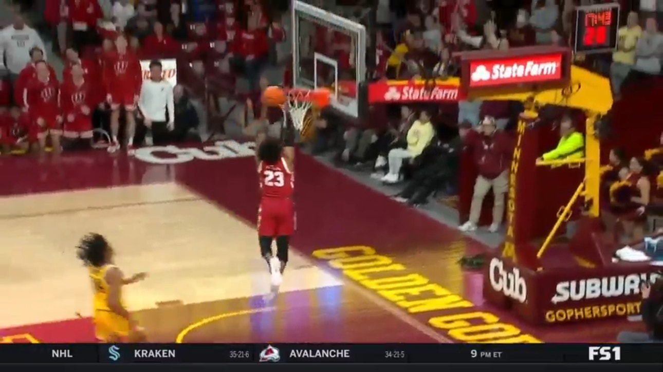 Wisconsin's Chucky Hepburn makes the steal and breaks free for a slam dunk over Minnesota 