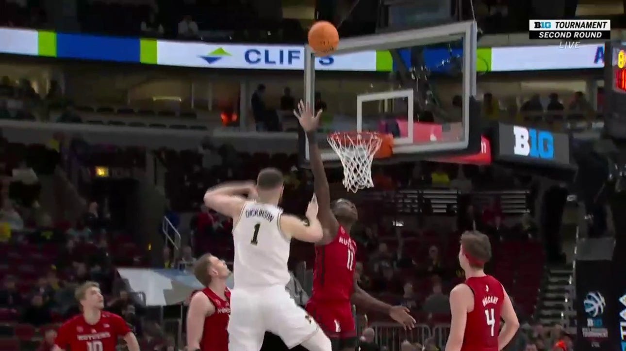 Michigan's Hunter Dickinson hits the turnaround hook-shot and draws the foul against Rutgers