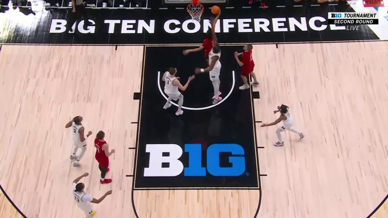 Rutgers' Derek Simpson catches Michigan defenders sleeping and grabs his own rebound for a bucket