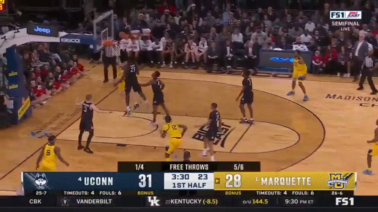 Marquette's Tyler Kolek scores a layup to add to his 14-point first-half performance against UConn.