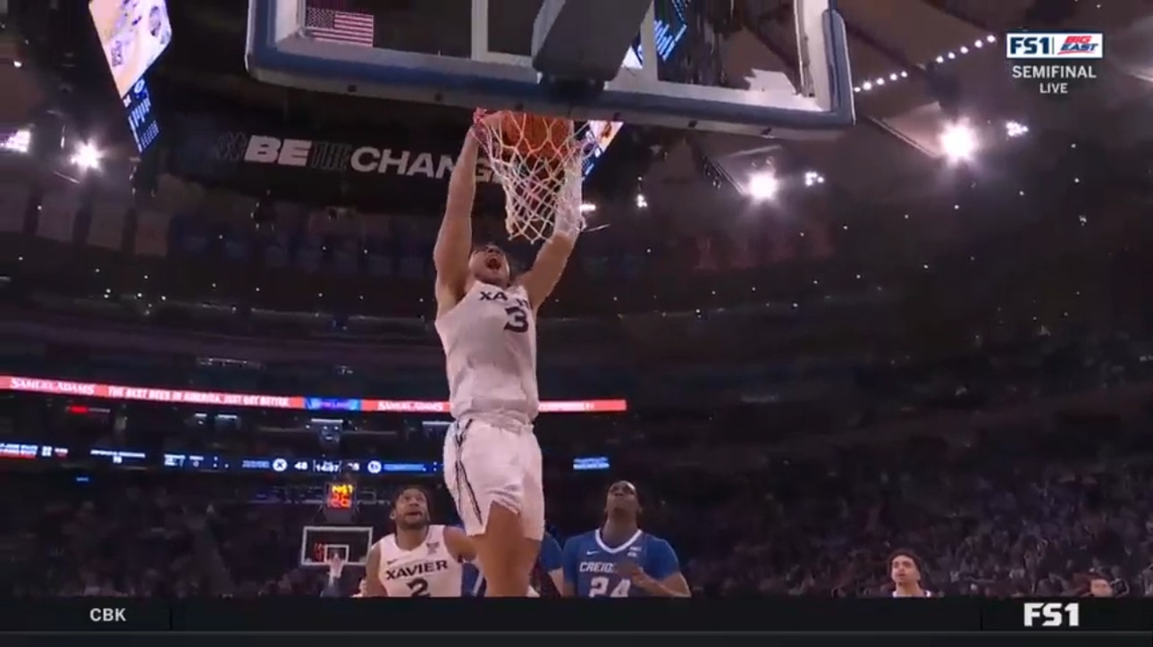 Xavier's Colby Jones flies by Creighton's defense for a two-handed slam