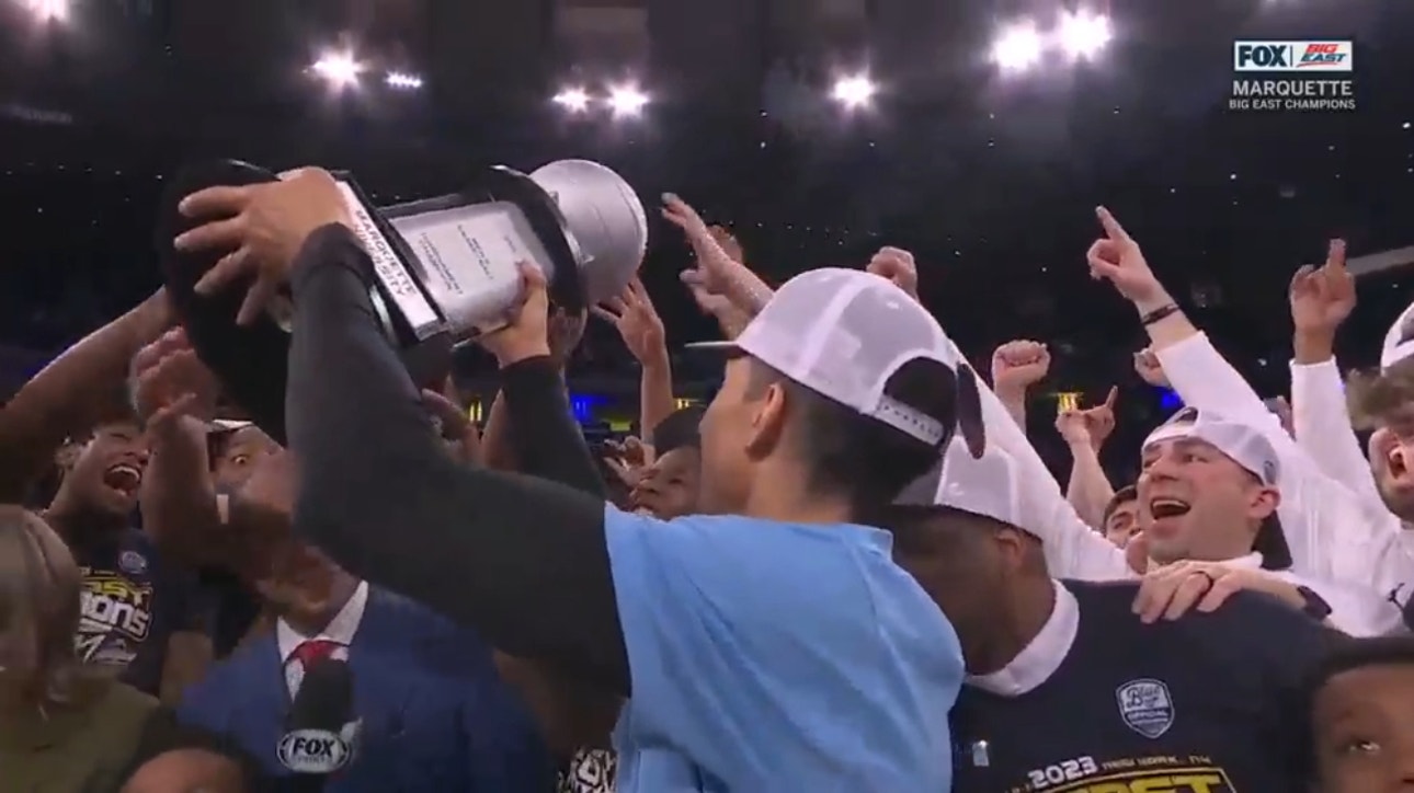 Marquette Golden Eagles hoist the trophy following their first Big East Tournament Championship win