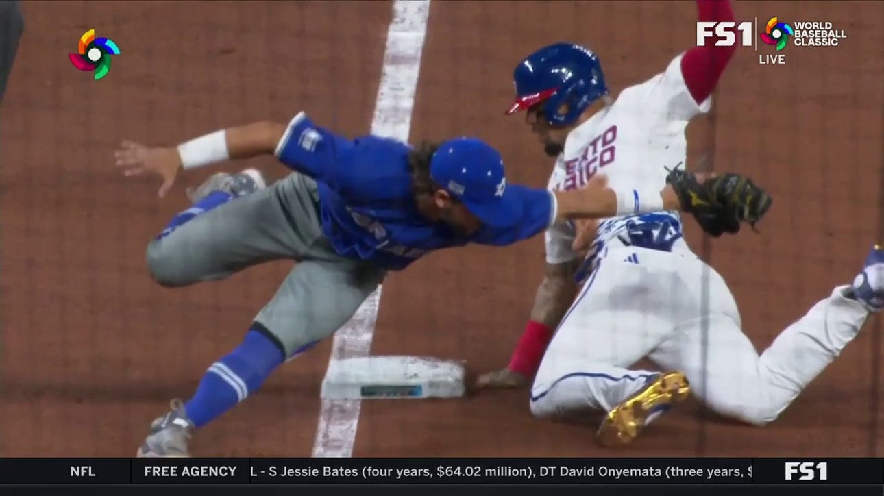 Puerto Rico's Javier Báez steals third base and magically avoids being tagged against Israel