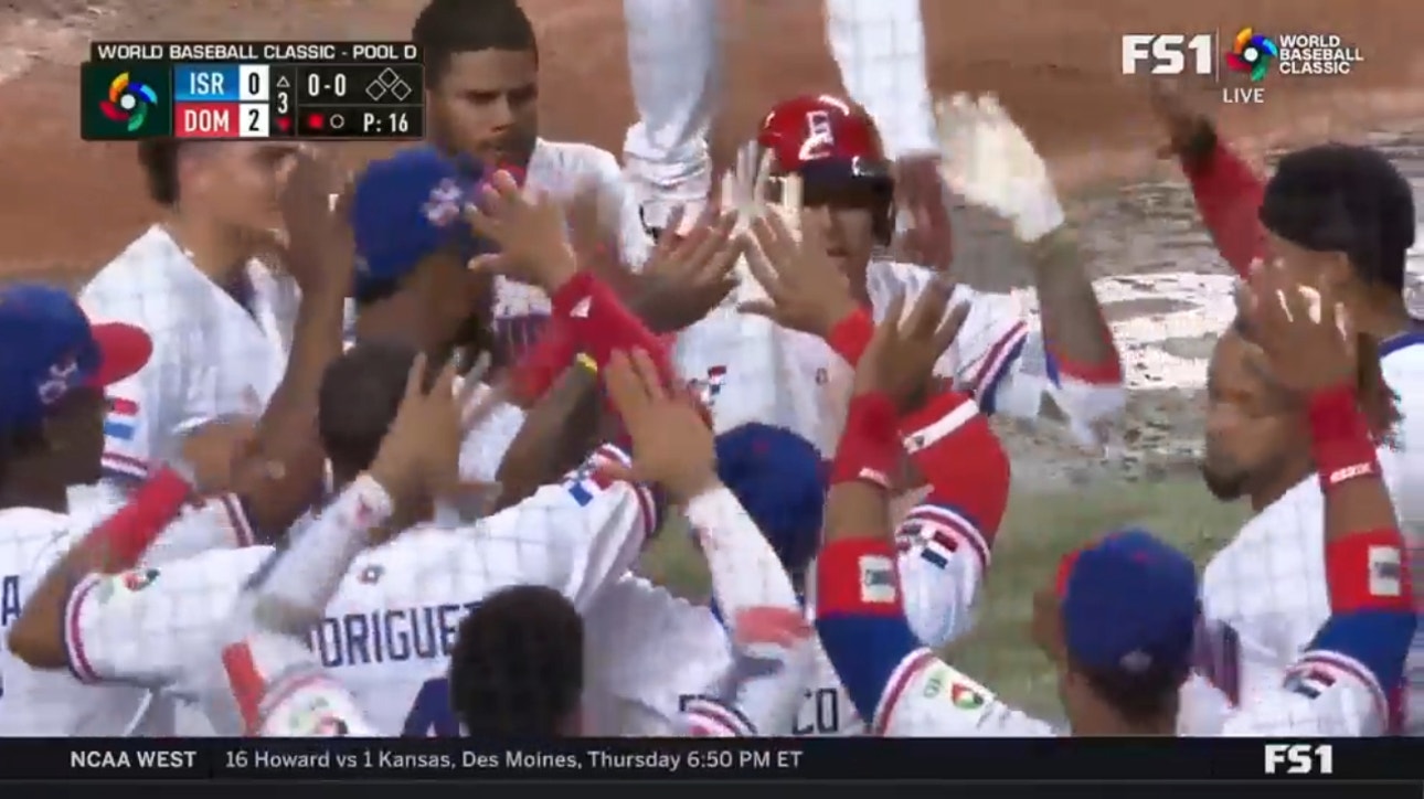 Dominican Republic's Manny Machado sends a moonshot to left-center field for a 2-0 lead