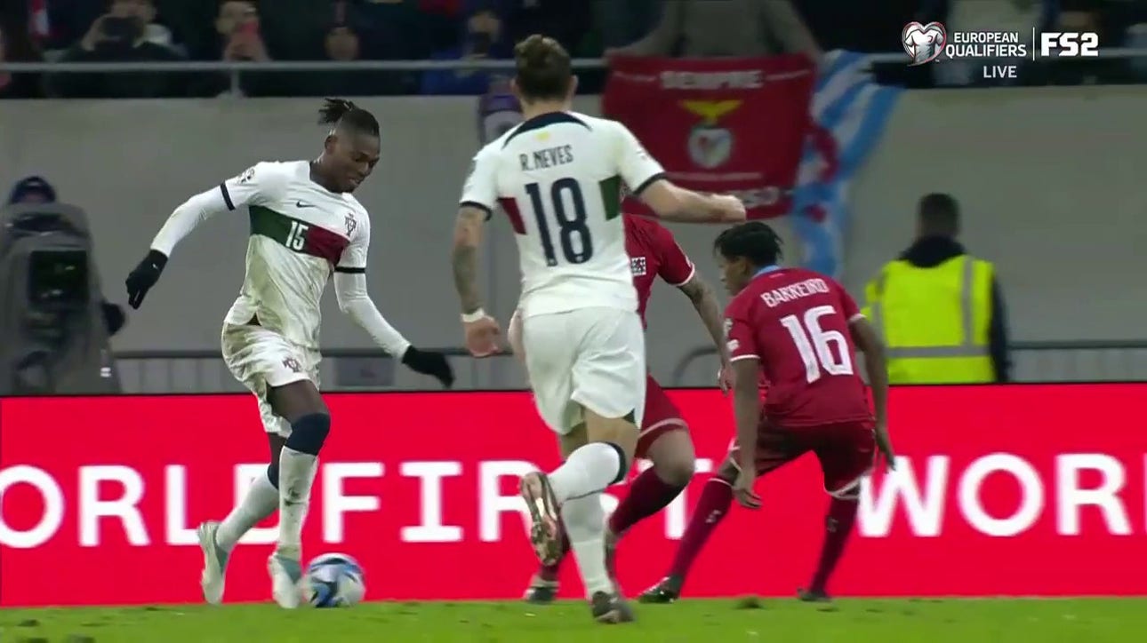 Rafael Leao scores against two Luxembourg defenders to give Portugal a 6-0 lead