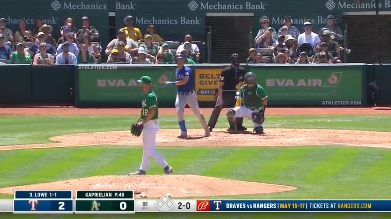 Rangers' Nathaniel Lowe sends a solo blast to left field, extending the lead to 3-0 over the A's